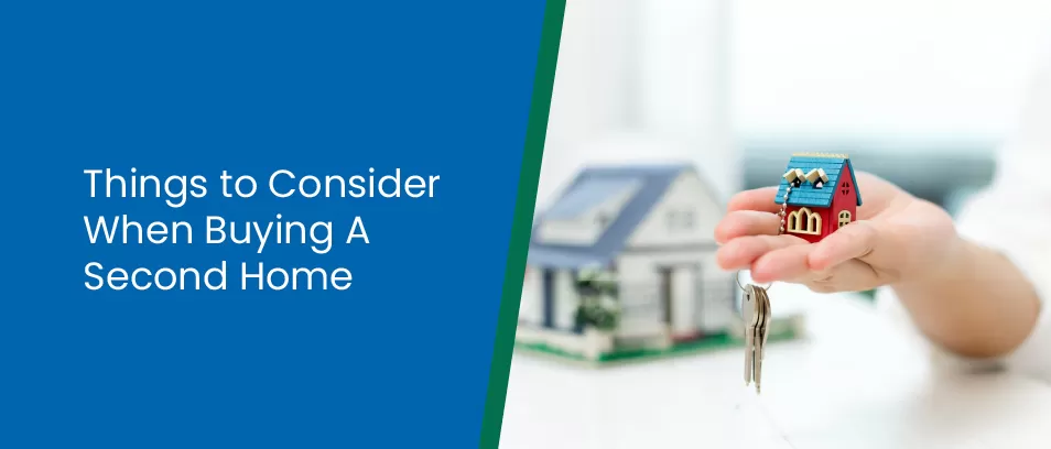 Things to Consider When Buying A Second Home - Image of a person holding a tiny house keychain